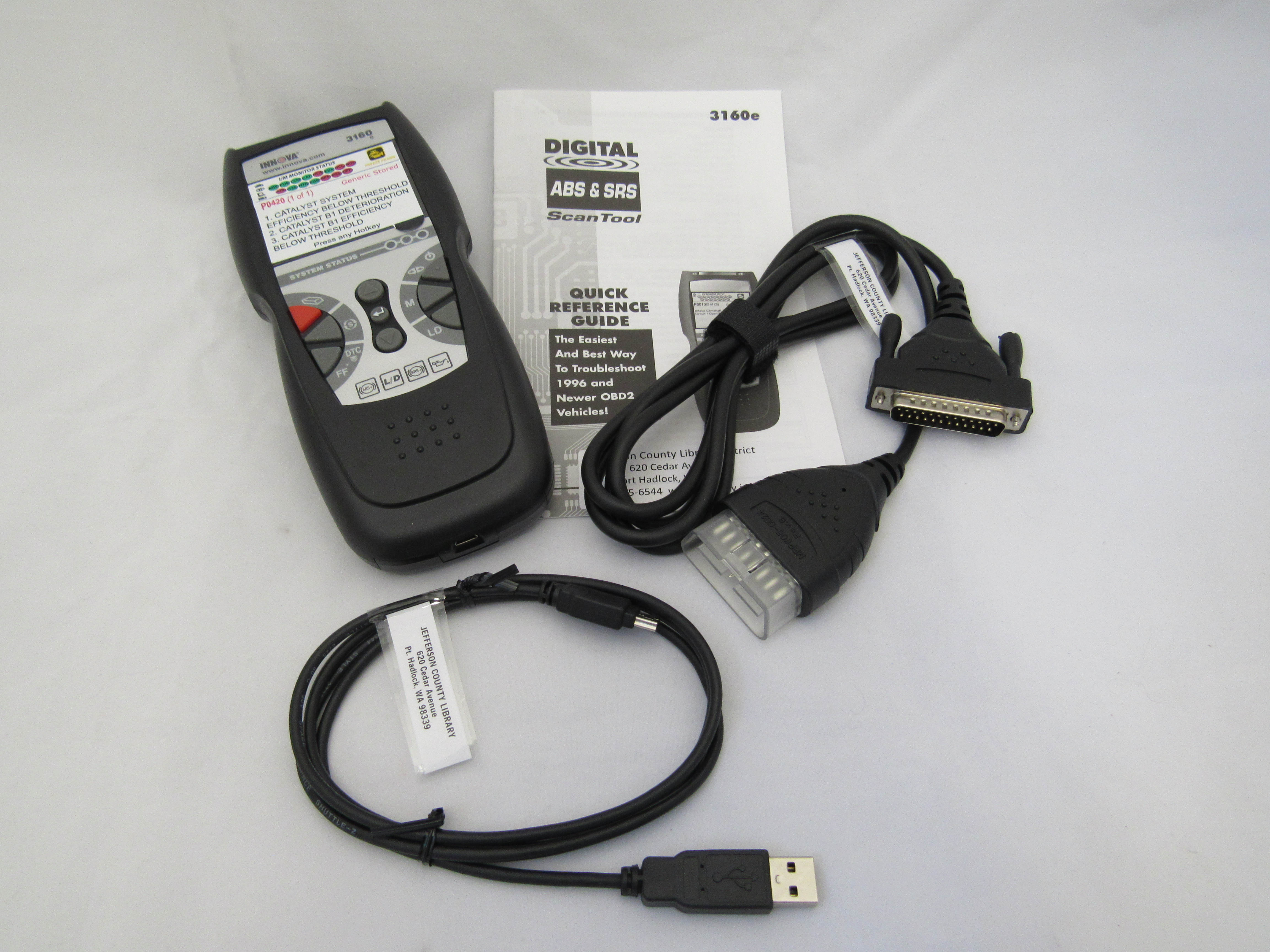 Photo of automotive diagnostic scan tool and instructions