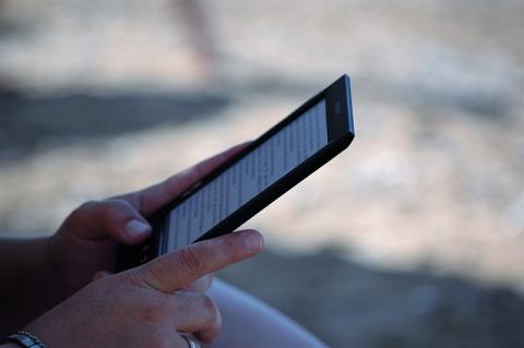 Hands holding an ebook reader