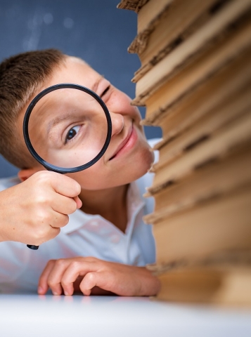 Boy with Magnifying Glass