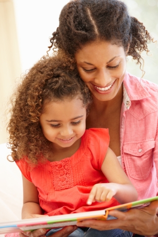 Mom and daughter reading together