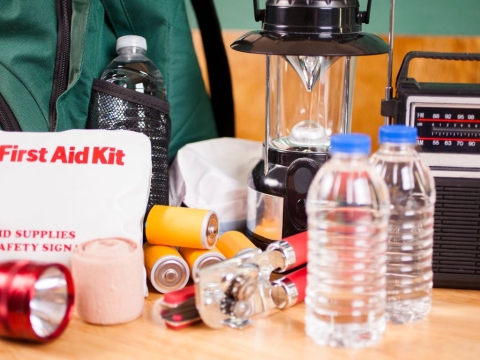 Emergency supplies including batteries, a lantern, and a first aid kit.