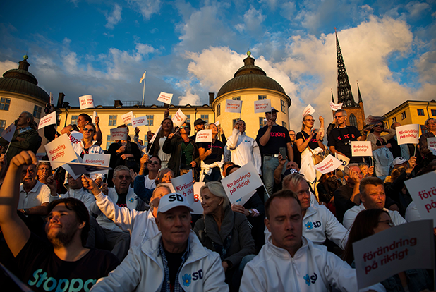 Image of a group of people holding protest signs