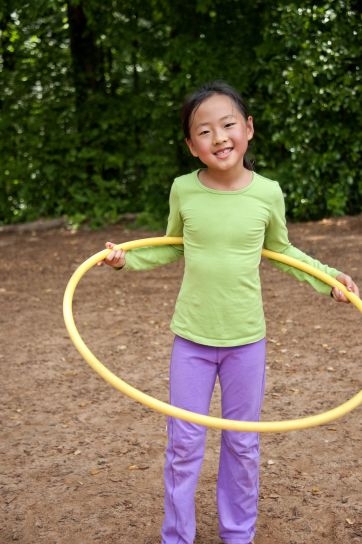 Young girl with hula hoop