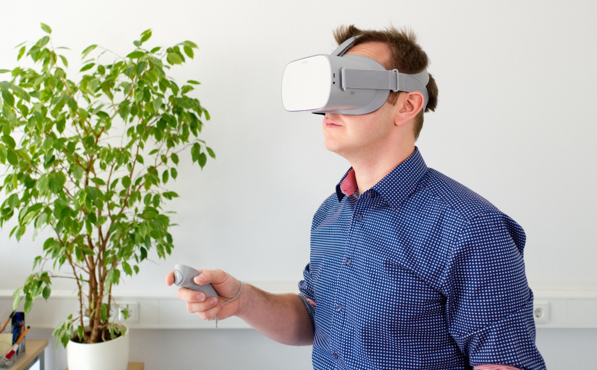 Man wearing virtual reality goggles.