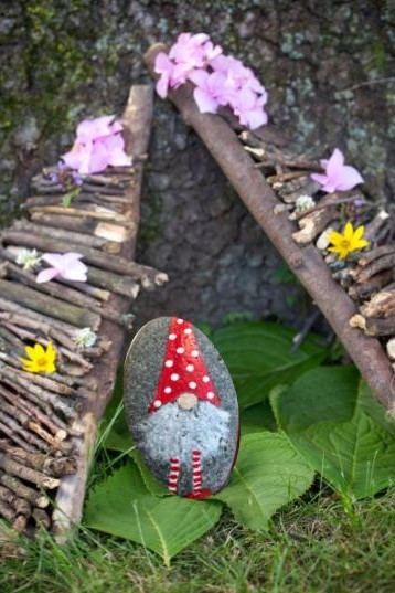 Gnome home made out of sticks and flowers