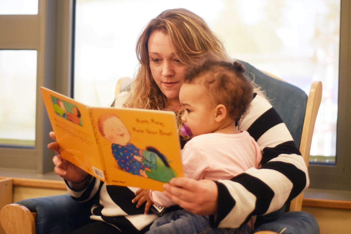 Mother reading to baby