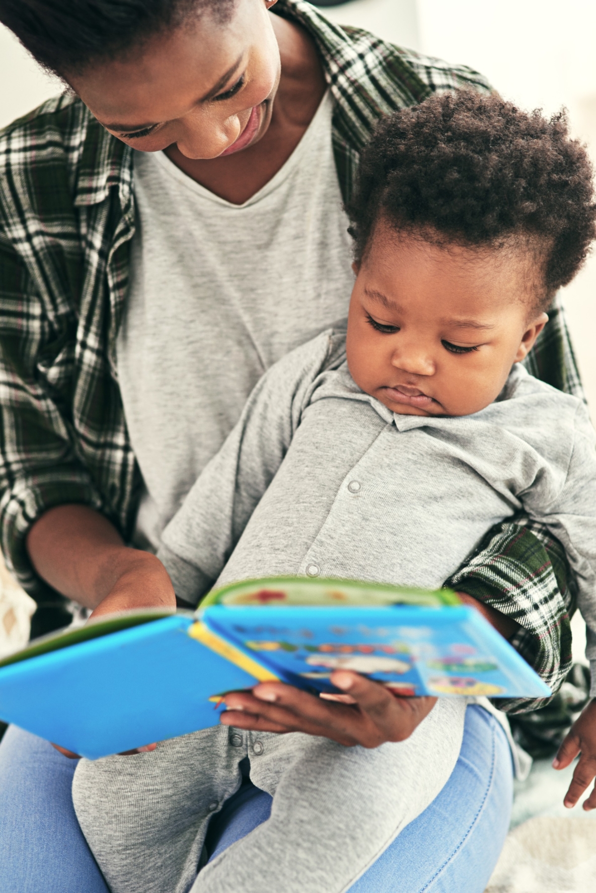 Baby reading with Mom