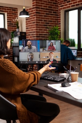 Woman on computer at a virtual meeting