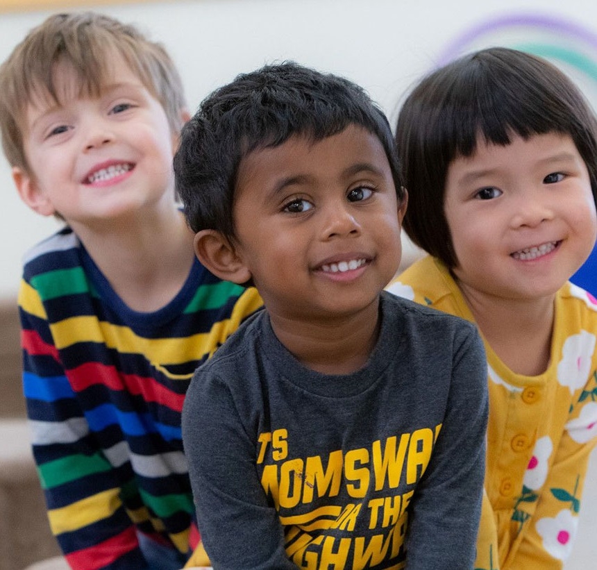 Three children smiling