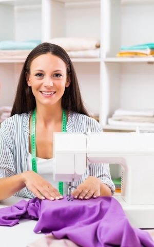 young woman using a sewing machine