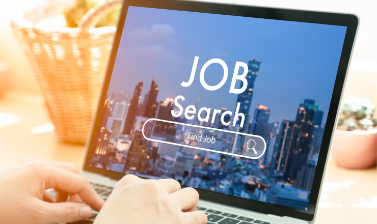 job and career linked image showing someone typing on laptop with a job search page on screen