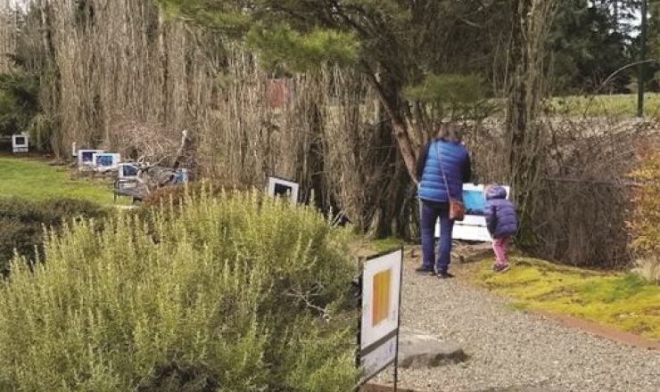 Mother and child enjoying a storywalk.